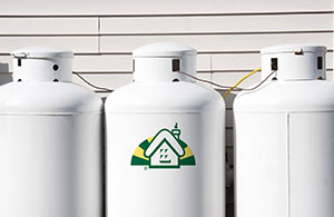 Propane tanks behind house